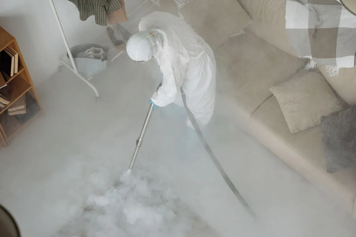 Biohazard cleanup technician in protective equipment, Lido Beach, NY